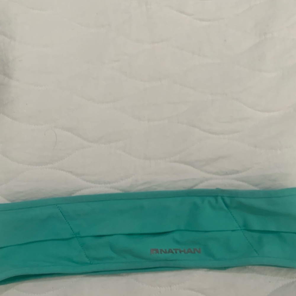 Nathan running belt fits over waist size medium